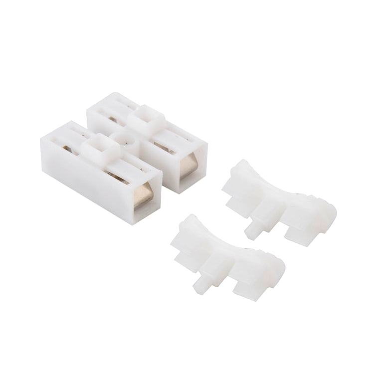 Set of white 2-way push quick cable connector terminals, visible dual entry channels