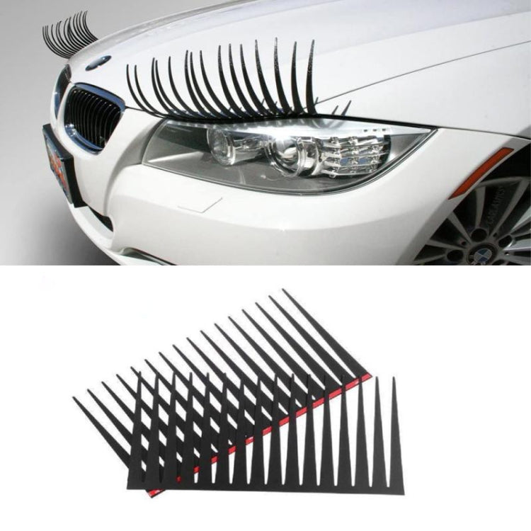 Black car eyelash strip decal with long lash spikes, set on a vehicle headlight area
