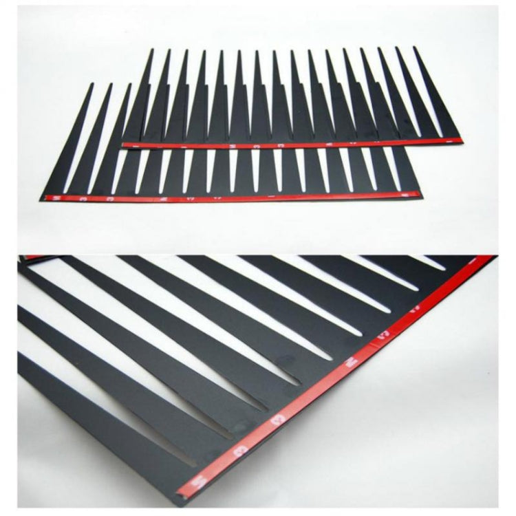 Pair of black car eyelash strip decals with red borders and dense lash spikes