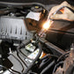 Hand using a circuit tester pen with probes on car engine wiring