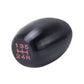 Black gear shift knob with red 135 4H 24R markings on side