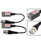 Two balun modules with black cables and BNC plugs