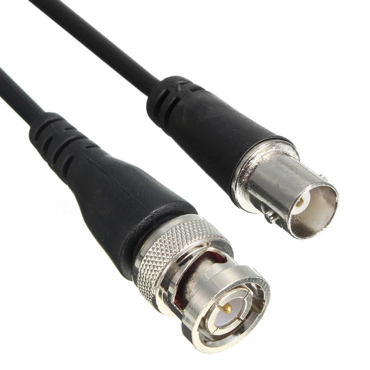 Close-up of coax connectors on a black cable pair with metal BNC-style ends
