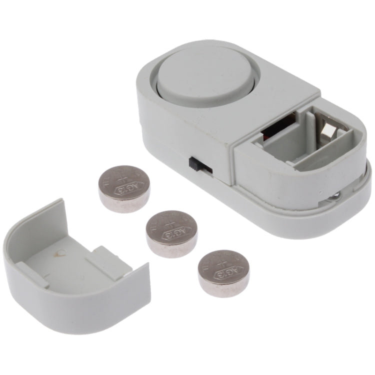 Magnetic alarm sensor with open battery compartment and two disc magnets, white