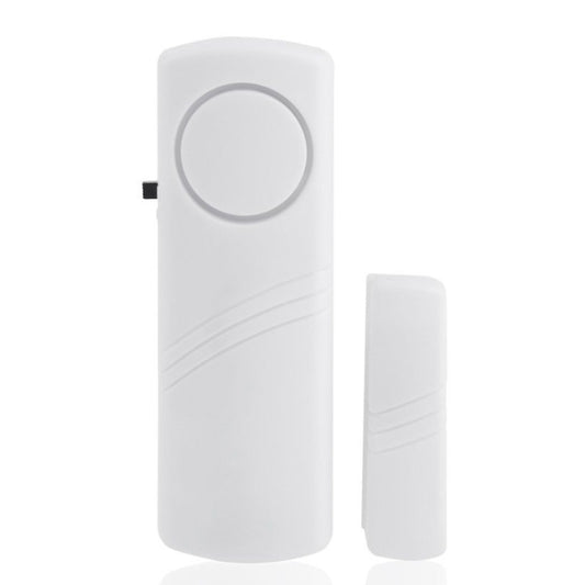 Wireless door/window alarm with round button and matching magnetic sensor
