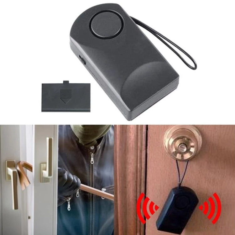 Black anti-theft alarm key fob with round button, charger plug and lanyard