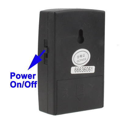 Black vibration alarm power on/off switch area with compliance label and charging port