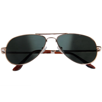 Front view of rose-gold sunglasses with dark oval lenses