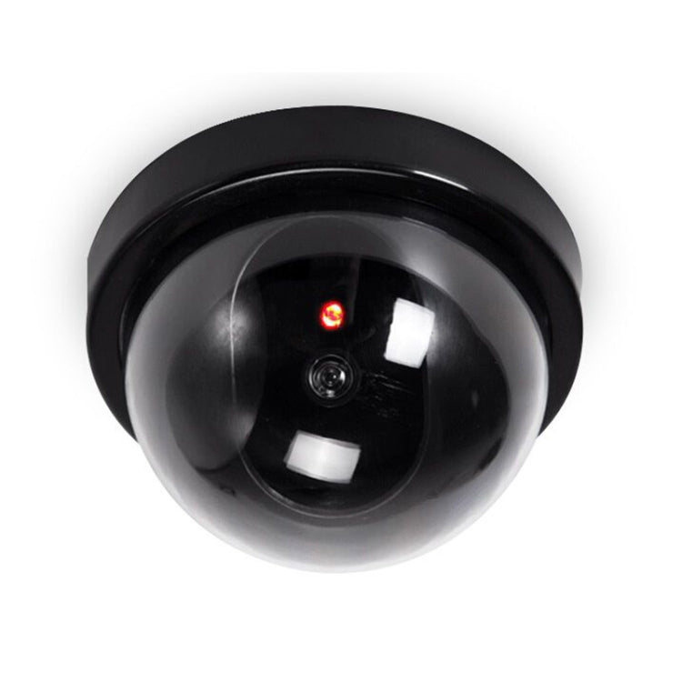 Dummy dome security camera, front view with glossy lens and glowing red LED