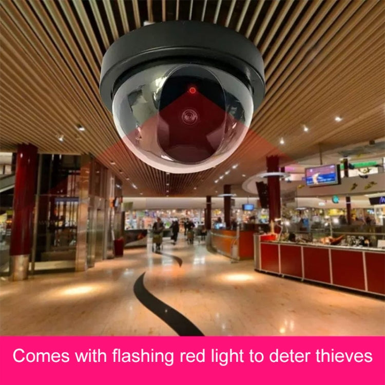 Dummy dome security camera installed on ceiling inside a shopping mall corridor