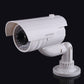 White dummy CCTV camera with angled housing and wall-mount base