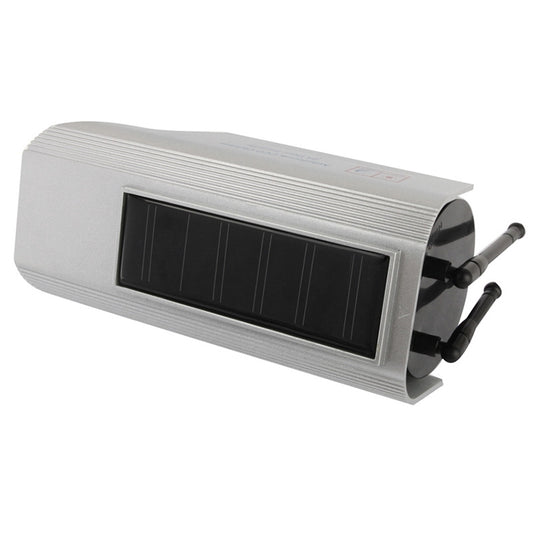 Solar-powered dummy security camera with top solar panel window and front lens