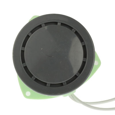 Security alarm buzzer with black circular cover and two white wire leads