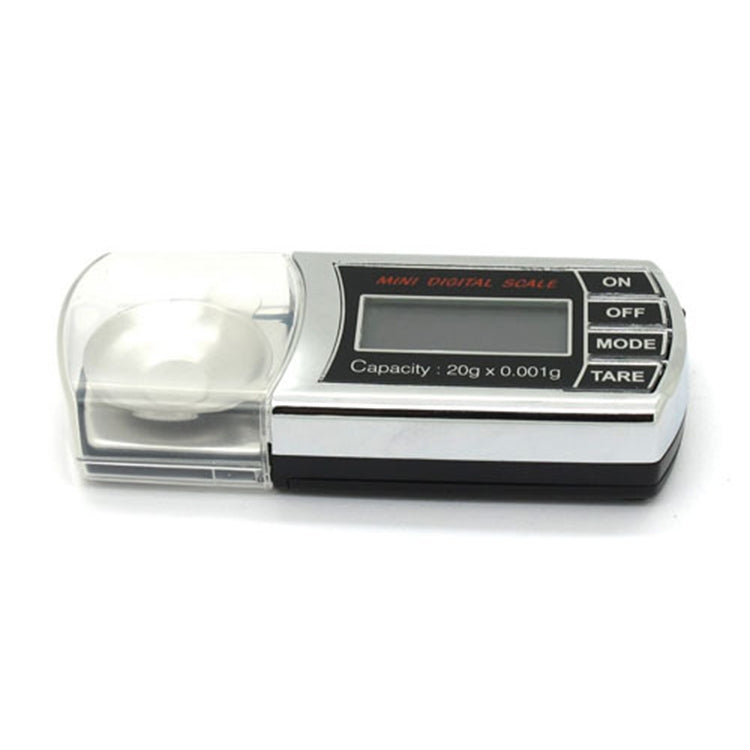 Mini digital scale with clear weighing lid and LCD display showing 0.00g
