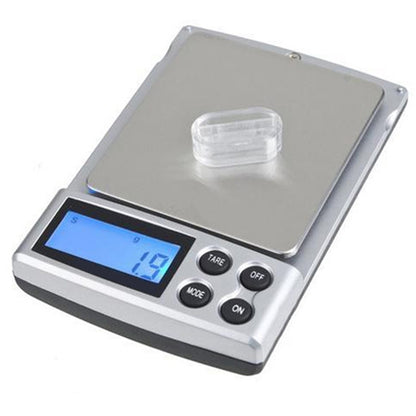 Digital pocket scale with stainless platform and blue LCD display, tare and on buttons