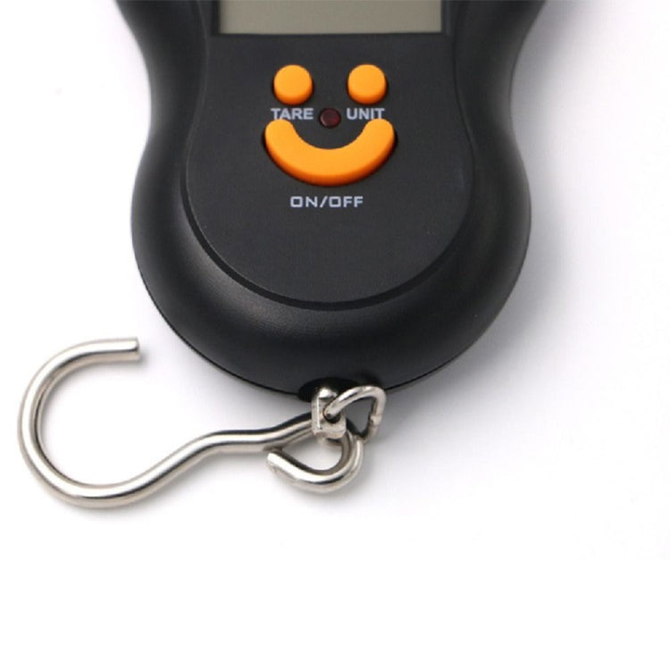 Black hanging LCD scale with orange control buttons and metal hanging hooks