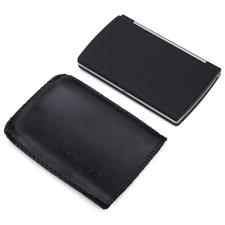 Compact digital scale with dark protective cover and storage pouch
