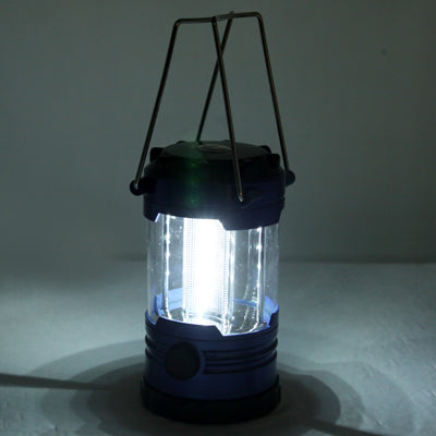 Blue LED lantern glowing with glass panels and carrying handle