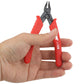 Mini cutter held in hand, red insulated handles and black jaws, -109 marking