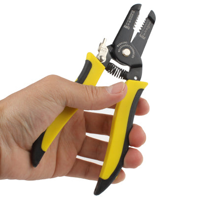 Wire stripping pliers tool held by hand, yellow handles and black cutting jaws