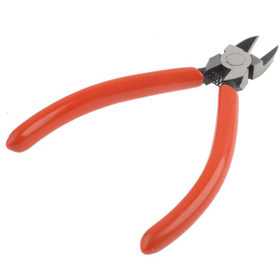 Red-handled plastic nippers, side view showing flat cutting blades