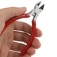 5-inch diagonal cutting pliers held in hand with red insulated grips