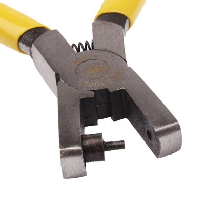 Close-up punch pliers head with yellow grips and circular punch opening