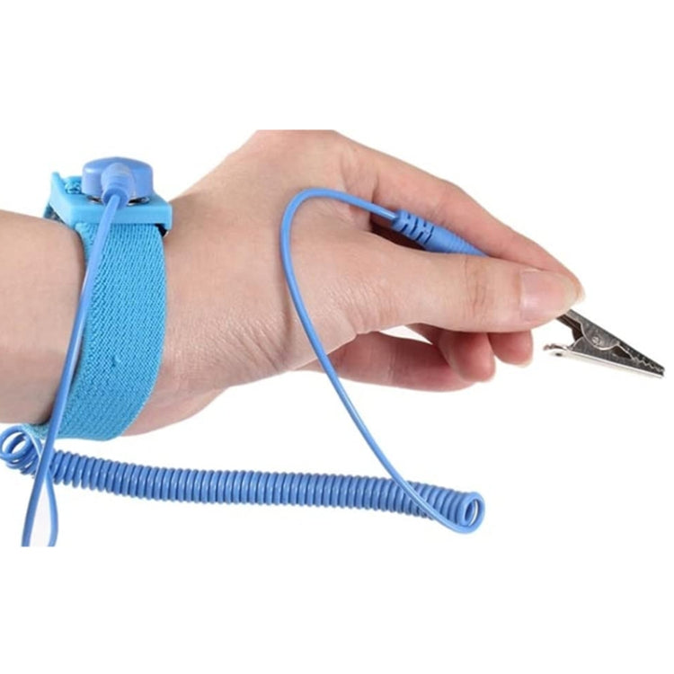 Blue anti-static wrist strap worn on hand with coiled grounding cable and metal clip