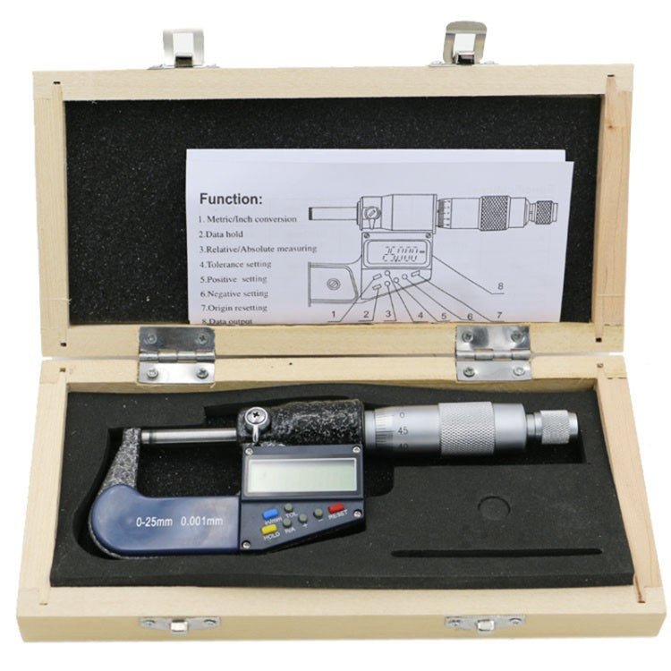 Digital micrometer kit in open wooden case with micrometer and foam insert