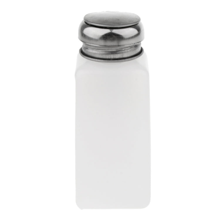 White liquid dispenser bottle with silver metal push-down cap