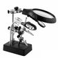LED magnifier stand with black handle, clear lens, and metal clamp tools