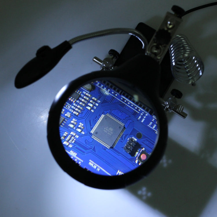 LED magnifier lens showing a close-up circuit board under bright light
