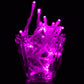 Purple LED string lights bundled together, round bulbs glowing bright