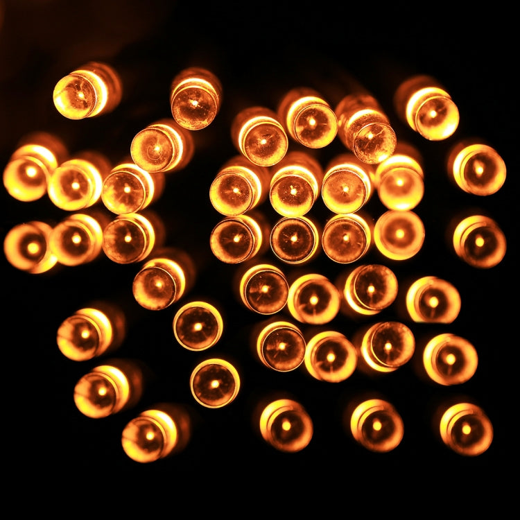 Amber LED string lights with round bulbs on clear wire, warm glow visible