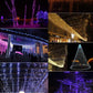 Outdoor LED light curtain with cone-like hanging strands, purple and warm white glow