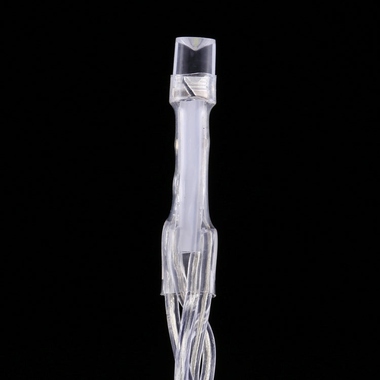 Transparent LED string light end connector with attached clear wire and small housing