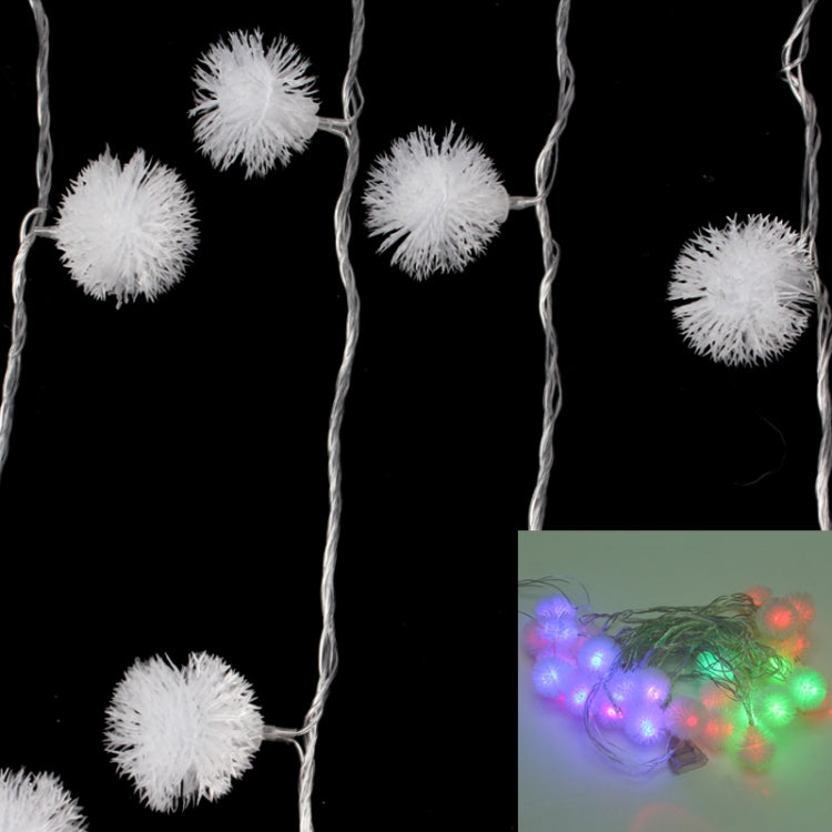 30-LED multi-colored string lights with white fuzzy pom-pom bulbs and glowing colors.
