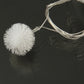 30-LED multi-colored string light with one white pom-pom bulb and clear connecting wire.