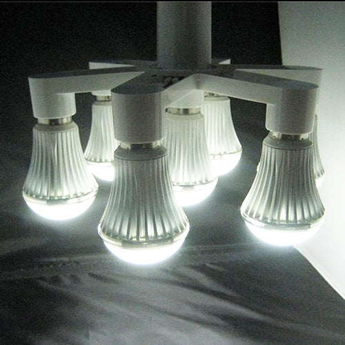 Seven-way E27 lamp holder converter with multiple lit bulbs and white multi-arm base