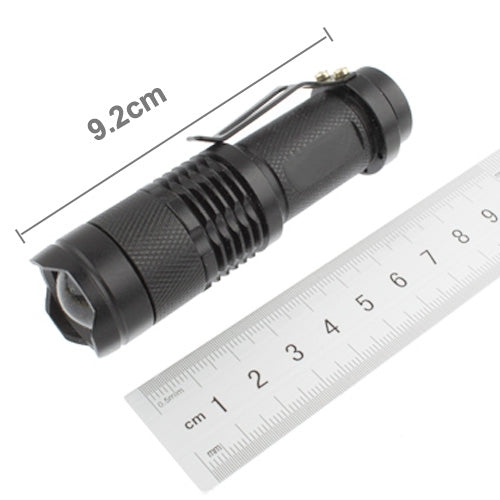 Black zoom LED flashlight with ridged grip; size marked 9.2 cm