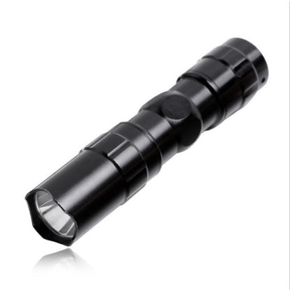 Black mini LED flashlight with textured grip and front lens