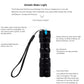 Black mini LED flashlight with wrist lanyard and segmented barrel
