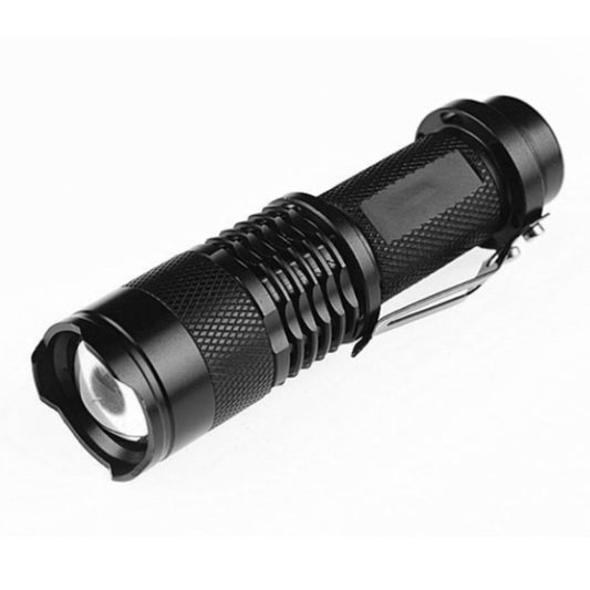 Black LED focus flashlight with textured grip and front lens, side view