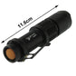 Black flashlight, 11.6 cm length, front lens bezel and lanyard clip