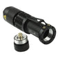 Black flashlight with threaded tailcap and open front head, metal rim ring