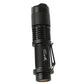 Black flashlight close-up with knurled grip, lanyard strap loop and front lens