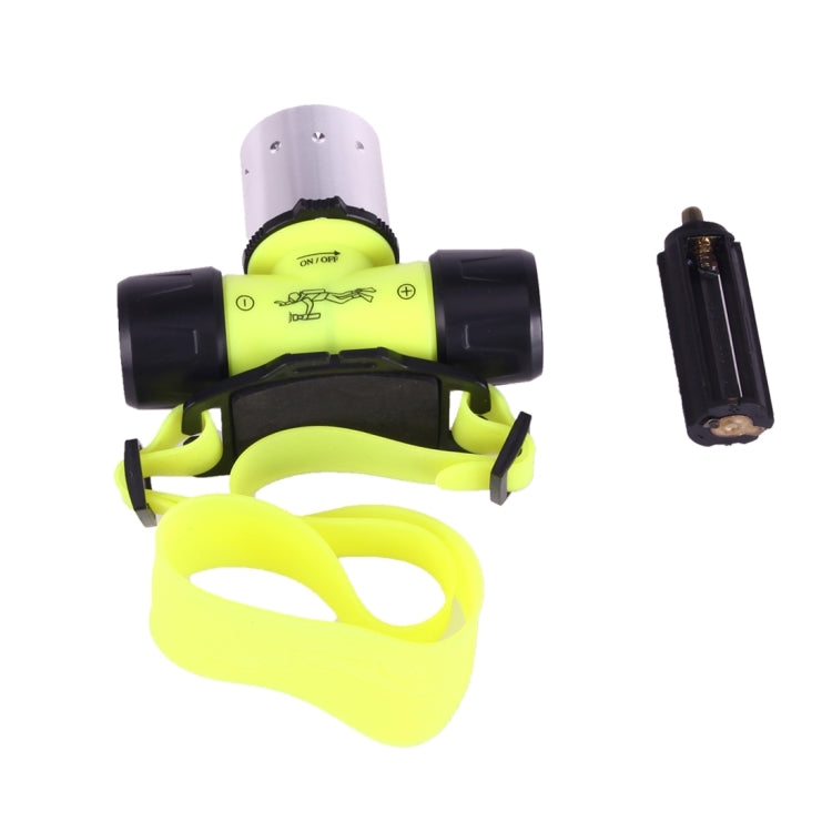 Lime green diving LED flashlight with black grips, lanyard strap, and small battery