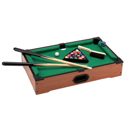Tabletop miniature pool table with green felt, billiard balls, two cues, and a brush