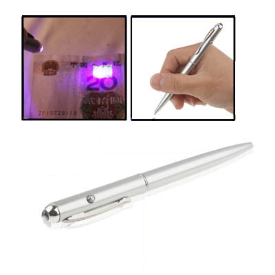 Metallic UV light pen held in hand, with bright purple UV glow on paper