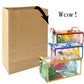 Kraft paper gift bag with black ribbon, with stacked gift boxes in front